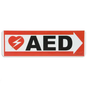 An AED wall sign with an arrow pointing right