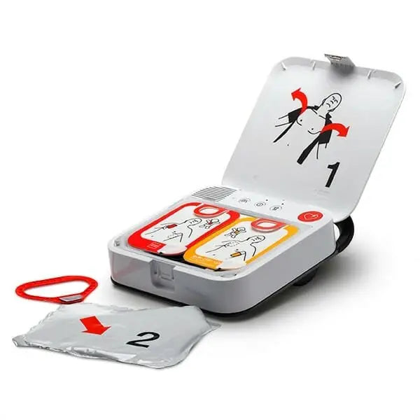 LifePak CR2 AED open on a table with pads laying out.