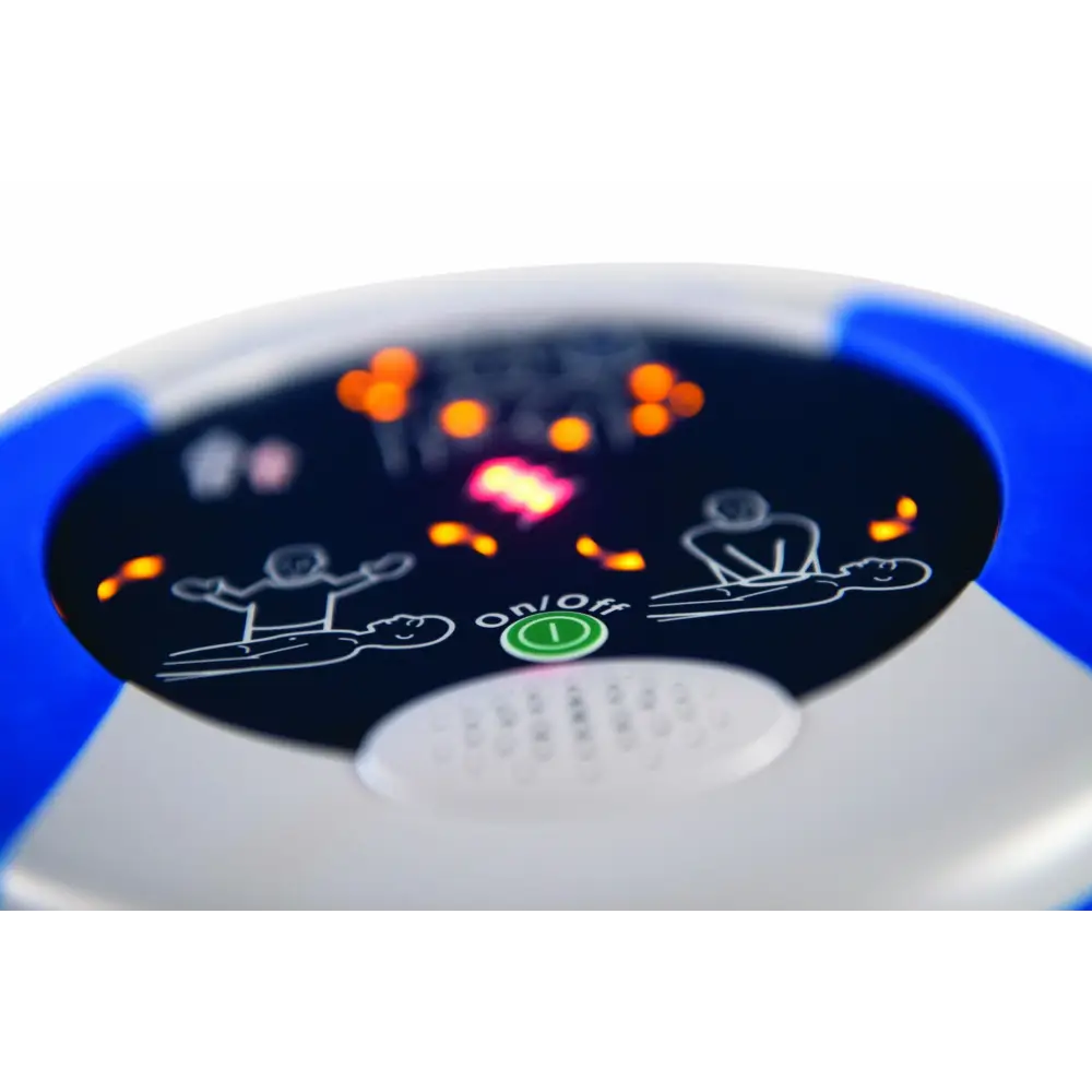 Extreme close up photo of the visual demonstrations on the front of a HeartSine Samaritan AED Pad with the lights on